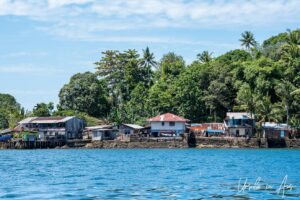 Houses on the shoreline of Pulau Doom, Southwest Papua, Indonesia.