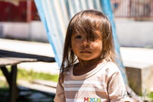 Environmental portrait: young child, Doom, Southwest Papua, Indonesia.
