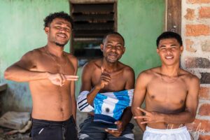 Three young men, Doom, Southwest Papua, Indonesia.