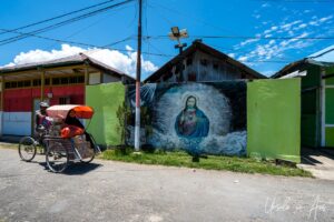 Jesus on a Wall A painting of Jesus on a wall, Doom, Southwest Papua, Indonesia.