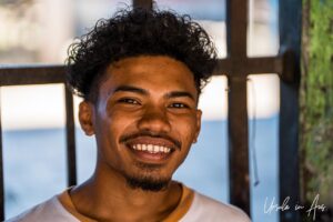 Environmental portrait: young man, Doom, Southwest Papua, Indonesia.