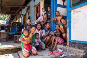 A group of local people mugging for the camera, Doom, Southwest Papua, Indonesia.