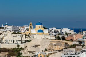 View over the Church of Saint George and the town of Oia, Santorini Greece