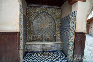 Tiled public fountain, Meknes medina, Morocco.