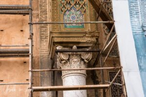 A Corinthian capital surrounded by scaffolding, the Mansour Gate, Meknes, Morocco