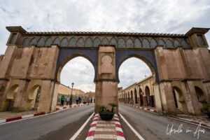 Arched gateways over a two-lane road, the kasbah, Meknes, Morocco.