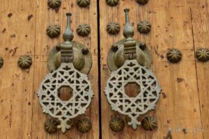 Detail: traditional Moroccan brass door knockers, Meknes