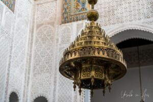 An ornate brass chandelier in the Mausoleum of Moulay Ismail, Meknes, Morocco