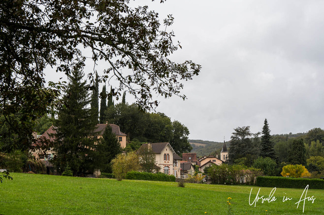 Old French village in green fields, Lot Valley.