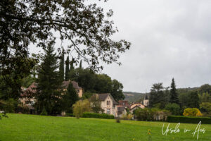 Old French village in green fields, Lot Valley.