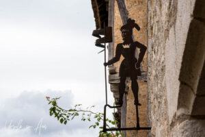 Cut metal signpost of a medieval knight, Saint-Cirq Lapopie, France