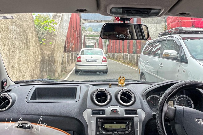 View over a car dashboard onto the Neriamangalam bridge over the Periyar River, India