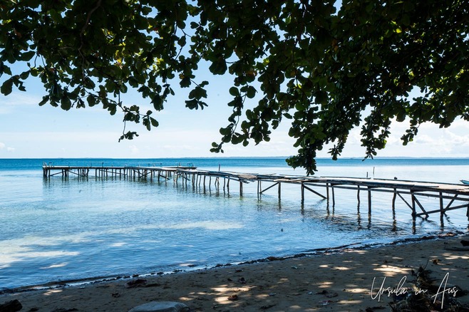 Wooden jetty over blue waters, Coral Triangle, Pulau Soop Indonesia
