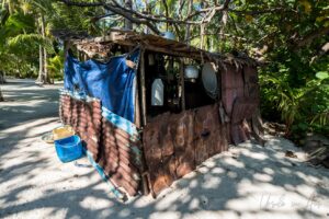 A beach hut of corrugated sheeting and plastic, Pulau Soop Indon