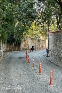 Traffic cones up the curving centre of Yahya Efendi Sokağı, Istanbul Türkiye