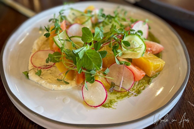A golden beet salad with tomatoes goat cheese local pea shoots and vinaigrette, Blacktail Restaurant, Daajing Giids Canada