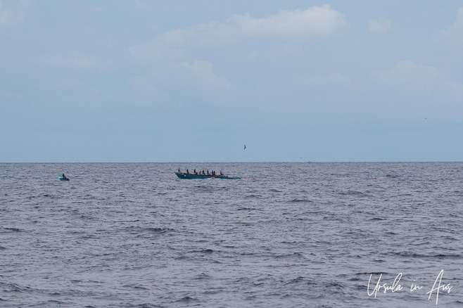 Long wooden fishing boat on the water, Banda Islands, Indonesia 