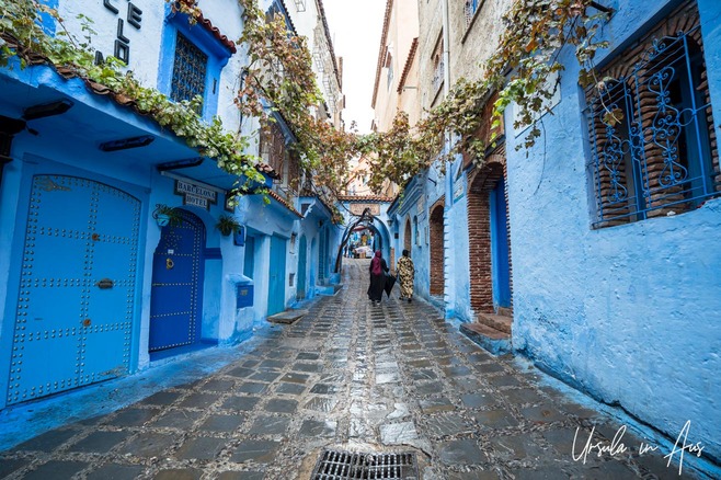 Women in abayas in Rue Bin Souaki, Chefchaouen, Morocco