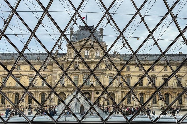 The Louvre Palace viewed from inside the Pyramid, Paris France