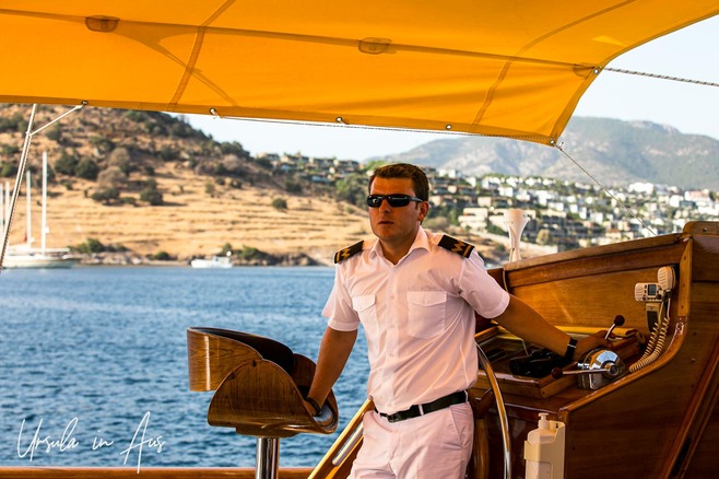 Captain at the helm of a gulet, Bodrum Türkiye.