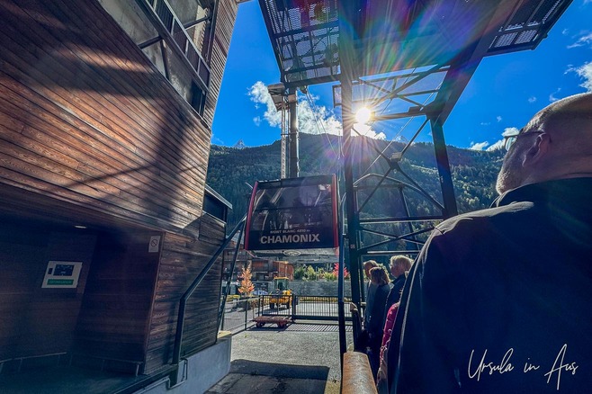 Sun over Aiguille du Midi from the Chamonix town cable car station, France.