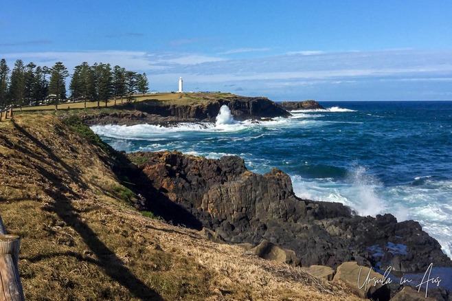 Seascape: looking north along the Kiama NSW shoreline to the lighthouse, Australia.