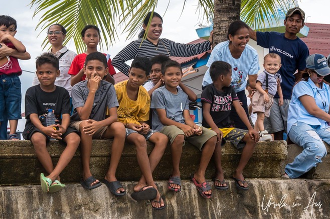A group of Yamdenan people on the waterfront, Saumlaki, Indonesia.