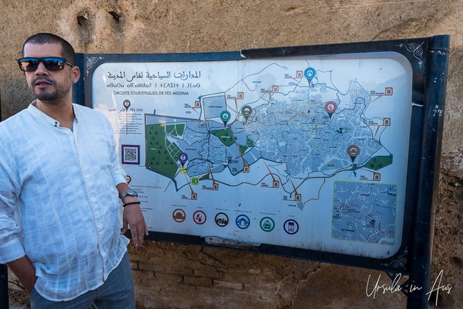 Portrait of a man with a map of the Fes medina, Morocco.