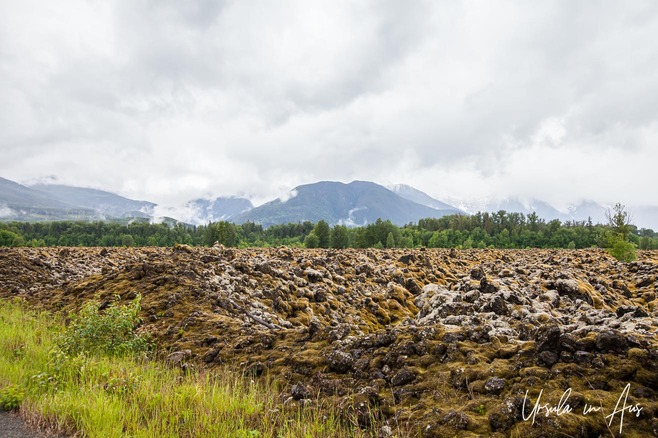 Mossy rocks against a mountain backdrop, the Nisga